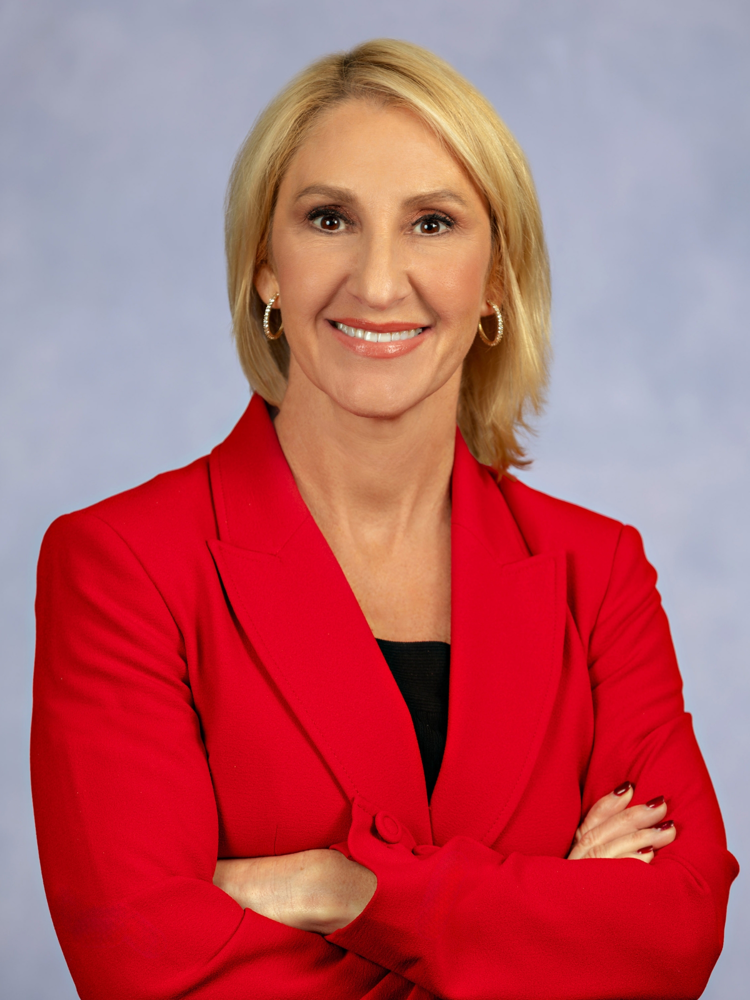 Headshot of Stacey Brandt, Executive Vice President, Chief Administrative Officer of Florida Health Sciences Center (FHSC), with a Light Gray Studio Backdrop